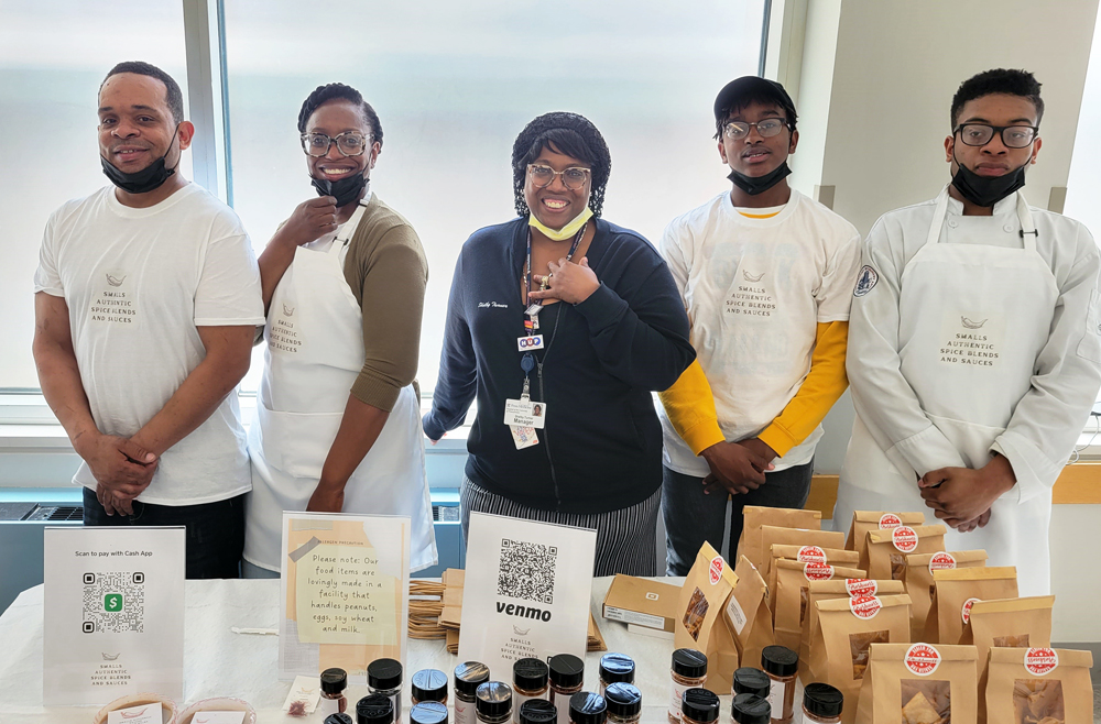 Shelby Turner with the staff of Smalls Authentic Spice Blends and Sauces